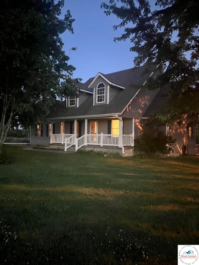1766 NW M Hwy, Clinton, MO 64735 - new england style home with covered porch and a front yard