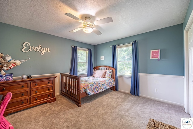 1766 NW M Hwy, Clinton, MO 64735 - carpeted bedroom with a textured ceiling and a ceiling fan