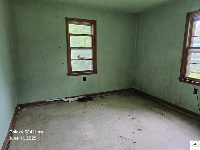 107 W 6th St, Urich, MO 64788 - empty room with tile patterned floors