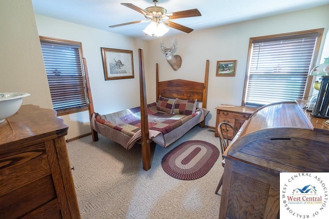 662 W 6th St, Schell City, MO 64783 - bedroom featuring light colored carpet, baseboards, and a ceiling fan