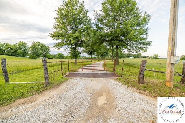 662 W 6th St, Schell City, MO 64783 - view of road featuring a gate and a rural view
