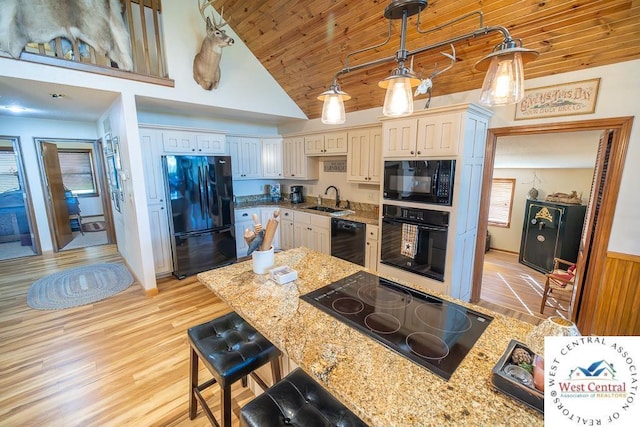 662 W 6th St, Schell City, MO 64783 - kitchen featuring black appliances, a sink, wood ceiling, decorative light fixtures, and light wood-style flooring