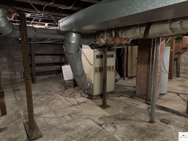 unfinished basement with heating unit and gas water heater
