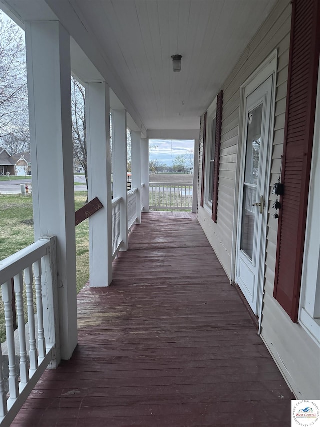 wooden deck featuring covered porch