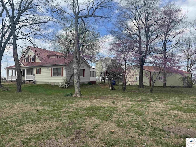 view of yard with covered porch