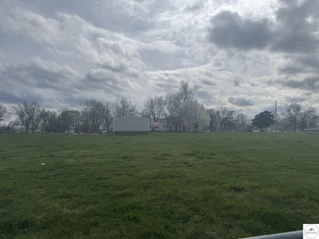 view of yard with a rural view