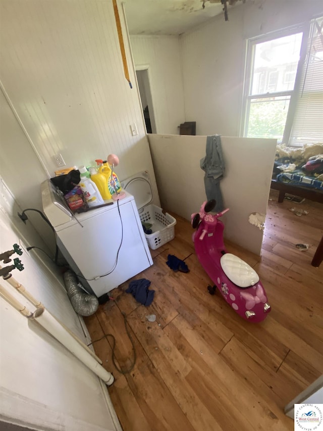 511 E Green St, Clinton, MO 64735 - washroom with wood-type flooring and washer / dryer