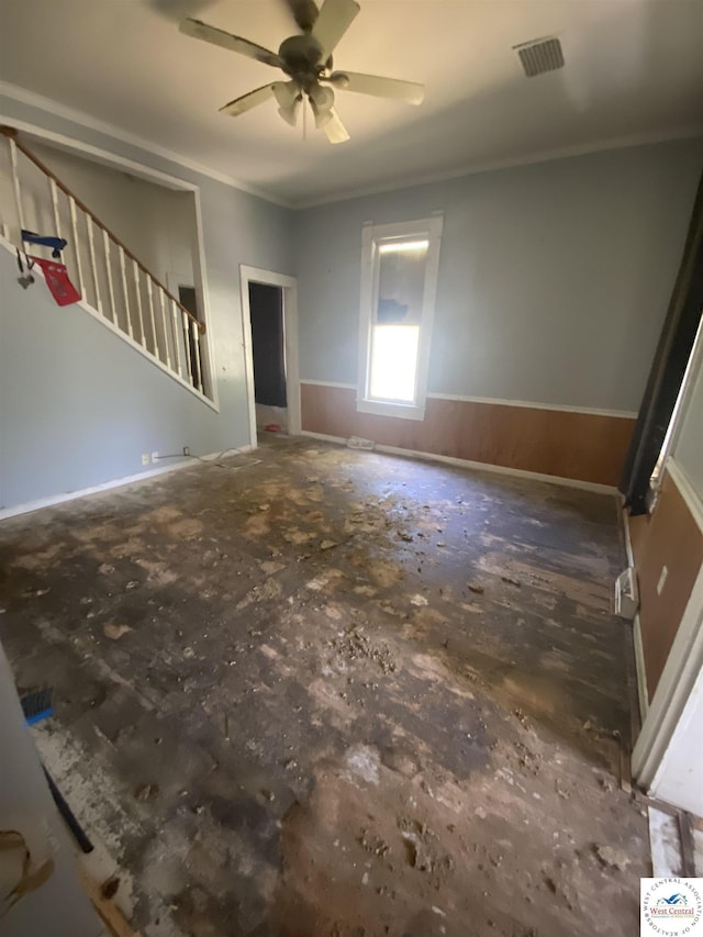 511 E Green St, Clinton, MO 64735 - unfurnished living room with a ceiling fan, ornamental molding, and stairway
