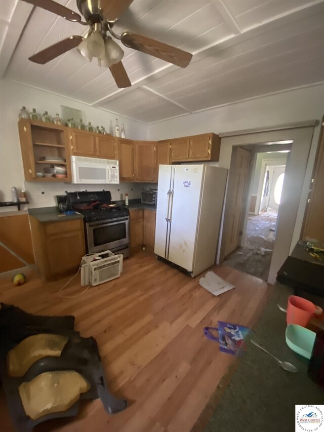 511 E Green St, Clinton, MO 64735 - kitchen featuring white appliances, ceiling fan, wood finished floors, brown cabinetry, and dark countertops
