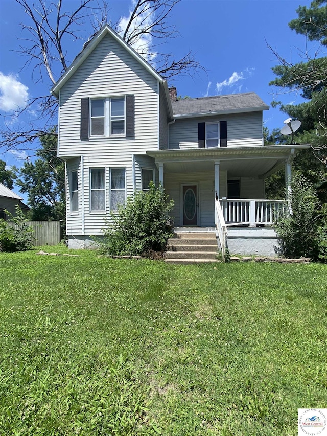 511 E Green St, Clinton, MO 64735 - view of front of home featuring covered porch and a chimney