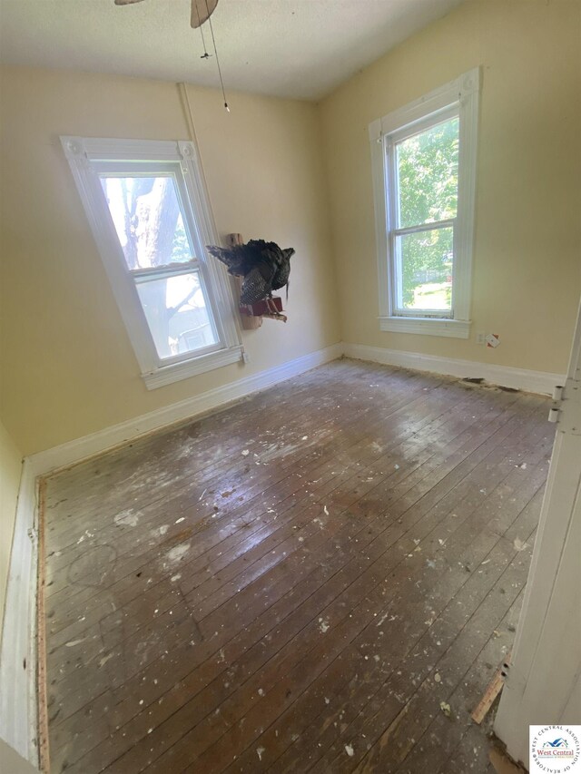 511 E Green St, Clinton, MO 64735 - spare room with hardwood / wood-style floors and a ceiling fan