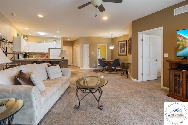 748 Pershing Dr, Camdenton, MO 65020 - living area with light colored carpet, visible vents, a ceiling fan, and recessed lighting