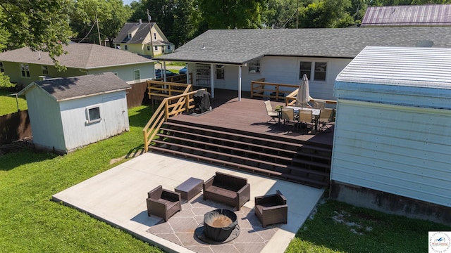 416 W Osage St, Warsaw, MO 65355 - rear view of house with outdoor dining area, a wooden deck, a patio, a shed, and an outdoor fire pit