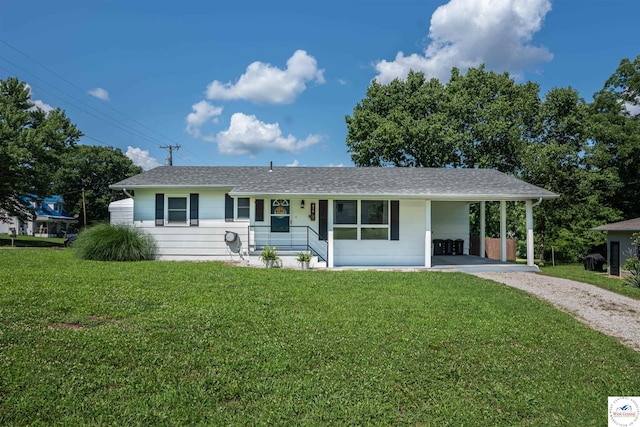 416 W Osage St, Warsaw, MO 65355 - ranch-style home with dirt driveway, a front yard, and an attached carport