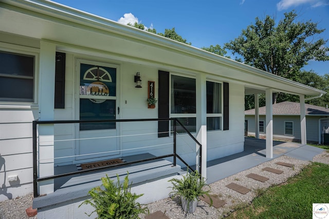 416 W Osage St, Warsaw, MO 65355 - view of exterior entry featuring covered porch