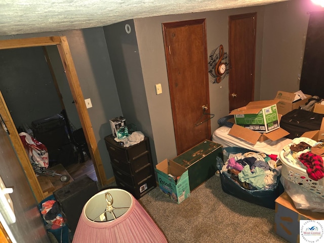 31591 Spring Ave, Warsaw, MO 65355 - carpeted bedroom with a textured ceiling