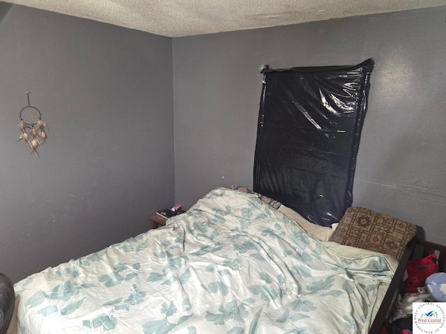 31591 Spring Ave, Warsaw, MO 65355 - bedroom featuring a textured ceiling