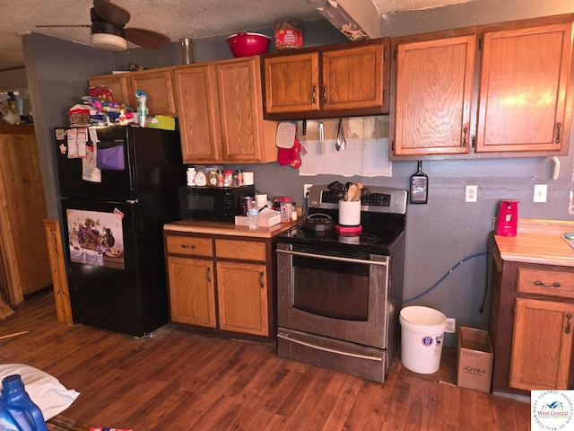 31591 Spring Ave, Warsaw, MO 65355 - kitchen with dark wood-style floors, brown cabinets, black appliances, a ceiling fan, and light countertops