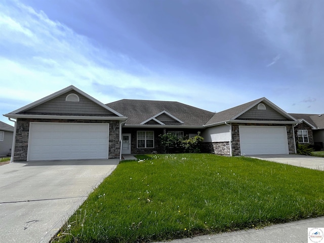ranch-style home with a front yard, driveway, stone siding, and an attached garage