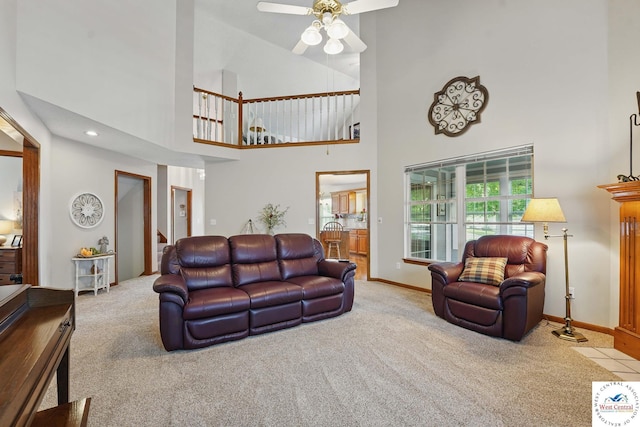 1515 NW Primrose Ln, Blue Springs, MO 64015 - carpeted living area with a high ceiling, a ceiling fan, stairs, and baseboards