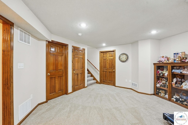 1515 NW Primrose Ln, Blue Springs, MO 64015 - finished below grade area with recessed lighting, carpet floors, stairs, and baseboards