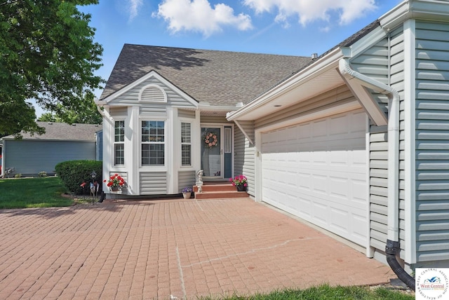 1515 NW Primrose Ln, Blue Springs, MO 64015 - view of front of house with roof with shingles, an attached garage, and driveway
