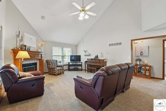 1515 NW Primrose Ln, Blue Springs, MO 64015 - carpeted living room with ceiling fan, high vaulted ceiling, a tiled fireplace, and baseboards