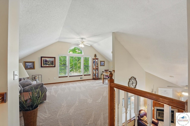 1515 NW Primrose Ln, Blue Springs, MO 64015 - interior space with ceiling fan, carpet, lofted ceiling, a textured ceiling, and baseboards