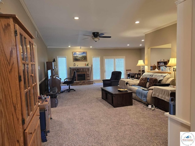1017 E Trevino Rd, Clinton, MO 64735 - carpeted living room with recessed lighting, ornamental molding, ceiling fan, and a brick fireplace