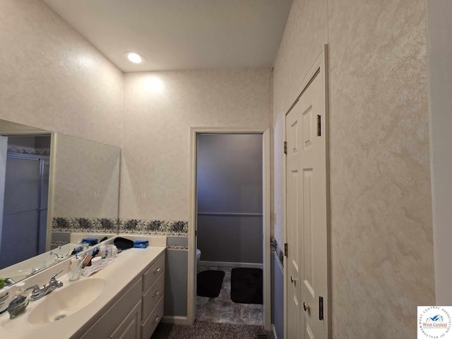 1017 E Trevino Rd, Clinton, MO 64735 - full bathroom featuring toilet, vanity, and a shower with door
