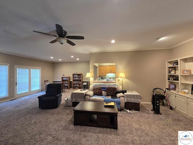 1017 E Trevino Rd, Clinton, MO 64735 - living area with carpet, crown molding, a ceiling fan, and recessed lighting