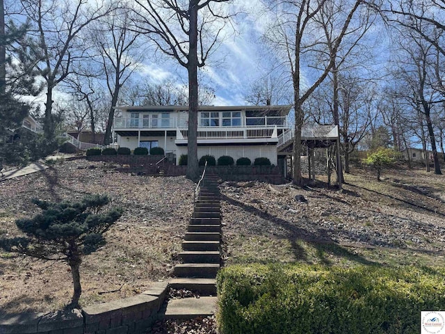 view of front of house with stairway