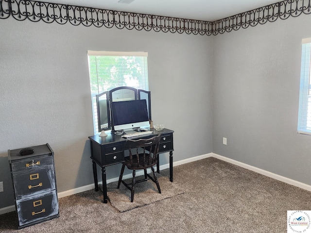 carpeted office space featuring baseboards