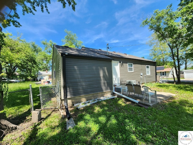 back of property featuring a patio