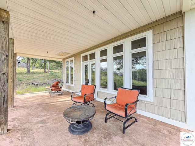 view of patio / terrace featuring an outdoor fire pit