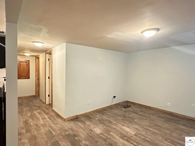 23651 Pifer St, Warsaw, MO 65355 - unfurnished room featuring wood finished floors and baseboards