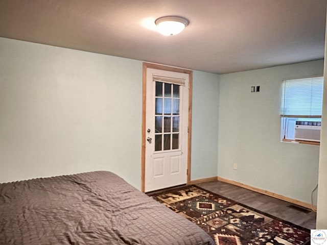23651 Pifer St, Warsaw, MO 65355 - bedroom featuring wood finished floors, baseboards, and cooling unit