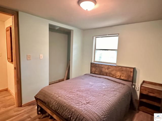 23651 Pifer St, Warsaw, MO 65355 - bedroom featuring light wood-style flooring and baseboards
