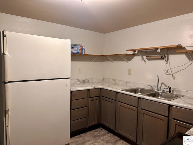 23651 Pifer St, Warsaw, MO 65355 - kitchen with freestanding refrigerator, open shelves, a sink, and light countertops
