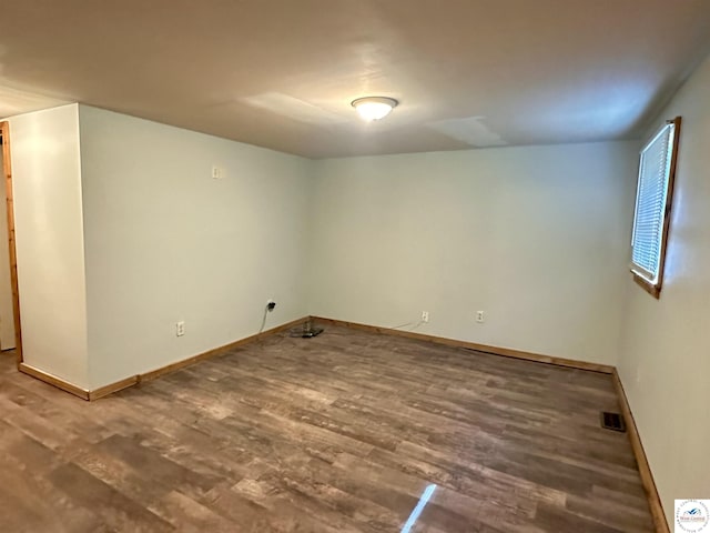 23651 Pifer St, Warsaw, MO 65355 - empty room featuring wood finished floors and baseboards