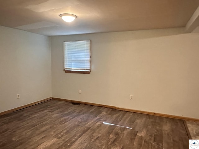 23651 Pifer St, Warsaw, MO 65355 - spare room with dark wood-style flooring and baseboards