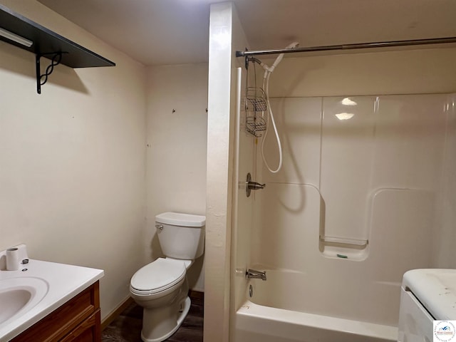 23651 Pifer St, Warsaw, MO 65355 - bathroom with vanity, toilet, washtub / shower combination, wood finished floors, and washer / dryer