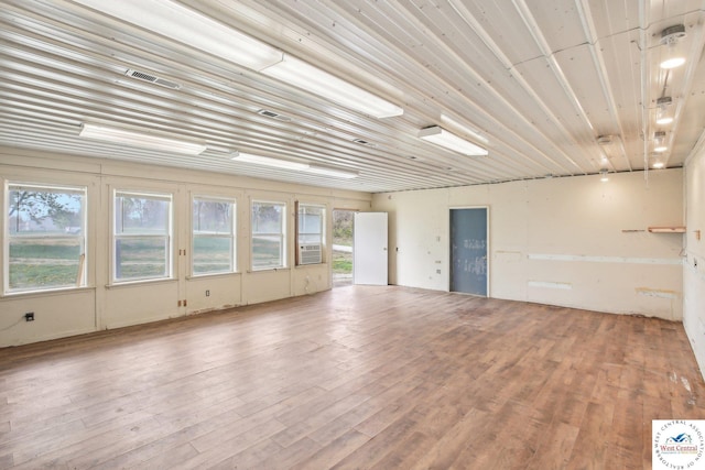 29950 Binder Rd, Green Ridge, MO 65332 - unfurnished room featuring wood finished floors and cooling unit
