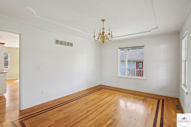 29950 Binder Rd, Green Ridge, MO 65332 - spare room featuring a tray ceiling, hardwood / wood-style floors, healthy amount of natural light, and ornamental molding