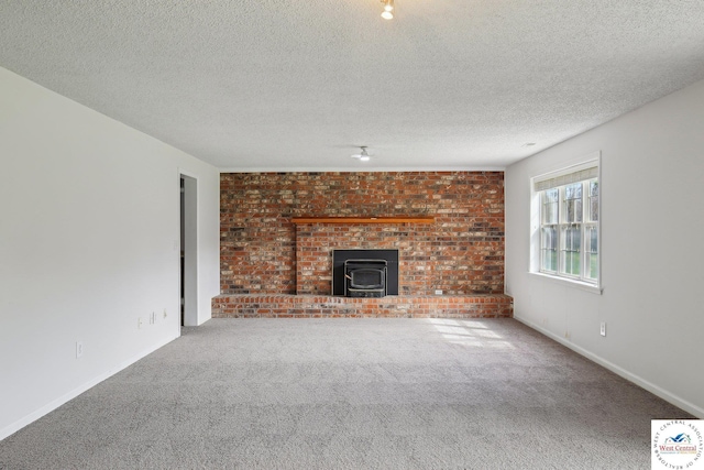 29950 Binder Rd, Green Ridge, MO 65332 - unfurnished living room featuring a wood stove, carpet flooring, a textured ceiling, and baseboards