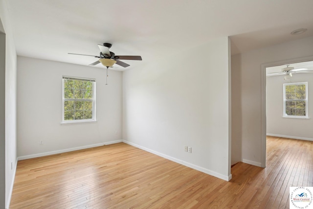 29950 Binder Rd, Green Ridge, MO 65332 - empty room with light wood-style floors, plenty of natural light, and ceiling fan