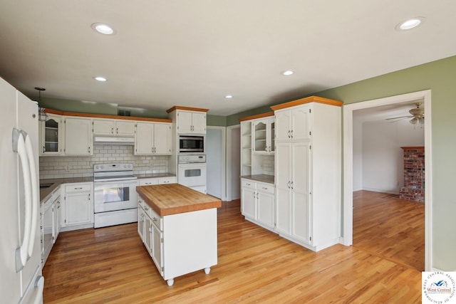 29950 Binder Rd, Green Ridge, MO 65332 - kitchen with white appliances, butcher block countertops, under cabinet range hood, light wood-style floors, and recessed lighting