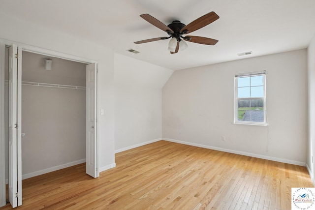 29950 Binder Rd, Green Ridge, MO 65332 - unfurnished bedroom with light wood-style floors, baseboards, a closet, lofted ceiling, and ceiling fan