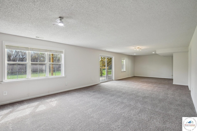 29950 Binder Rd, Green Ridge, MO 65332 - spare room with carpet floors, baseboards, and a textured ceiling