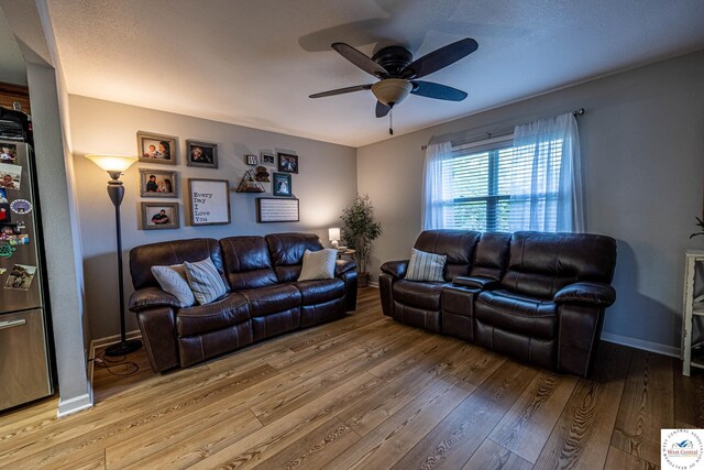 782 SE 250th Rd, Clinton, MO 64735 - living area featuring baseboards, ceiling fan, and hardwood / wood-style flooring